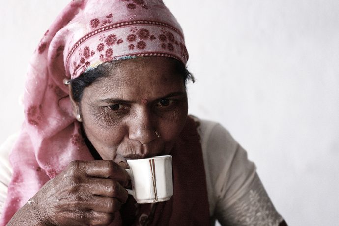 An employee at the ginning mill takes a well-deserved chai break. Photo courtesy of Kowtow.