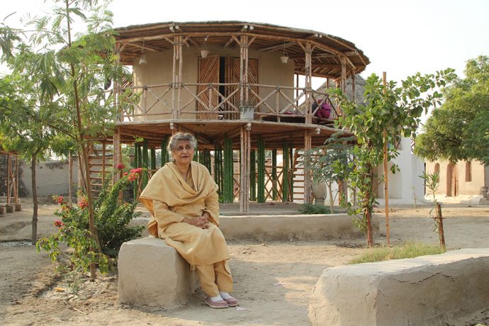 Yasmeen-Lari-outside-a-women's-centre-on-stilts-to-survive-floods-in-Sindh