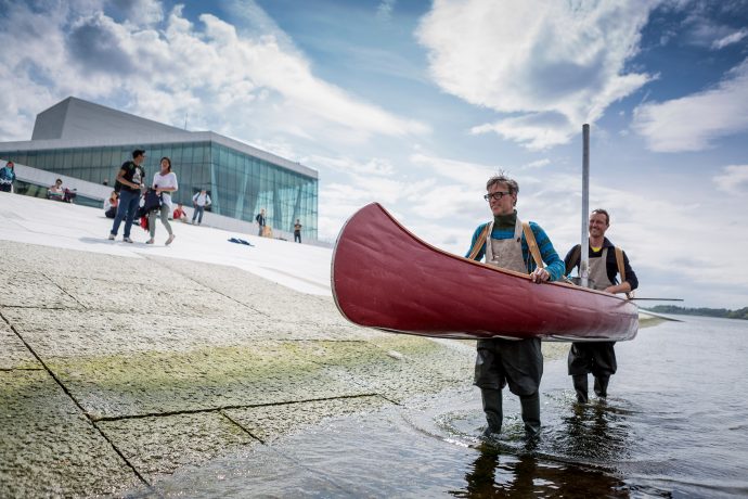 Members of the Flatbread Society tour their mobile bakehouse in front of the Oslo Opera House. Photo by Max McClure.