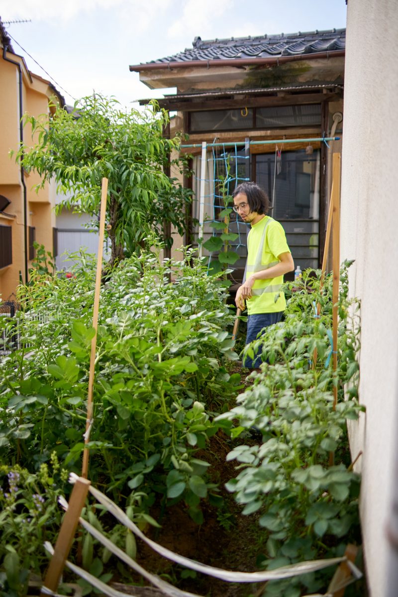 Japanese artist Satoshi Murakami in his studio showcasing alternative ways of living | Japanese man in his garden surrounded by green plants | Japanese house Tokyo | Co-working space | artists collective space | Japanese artists | Written by Grace Lovell and Yoshi Tsujimura Photography by Yoshi Tsujimura | edited by Sophie Rzepecky